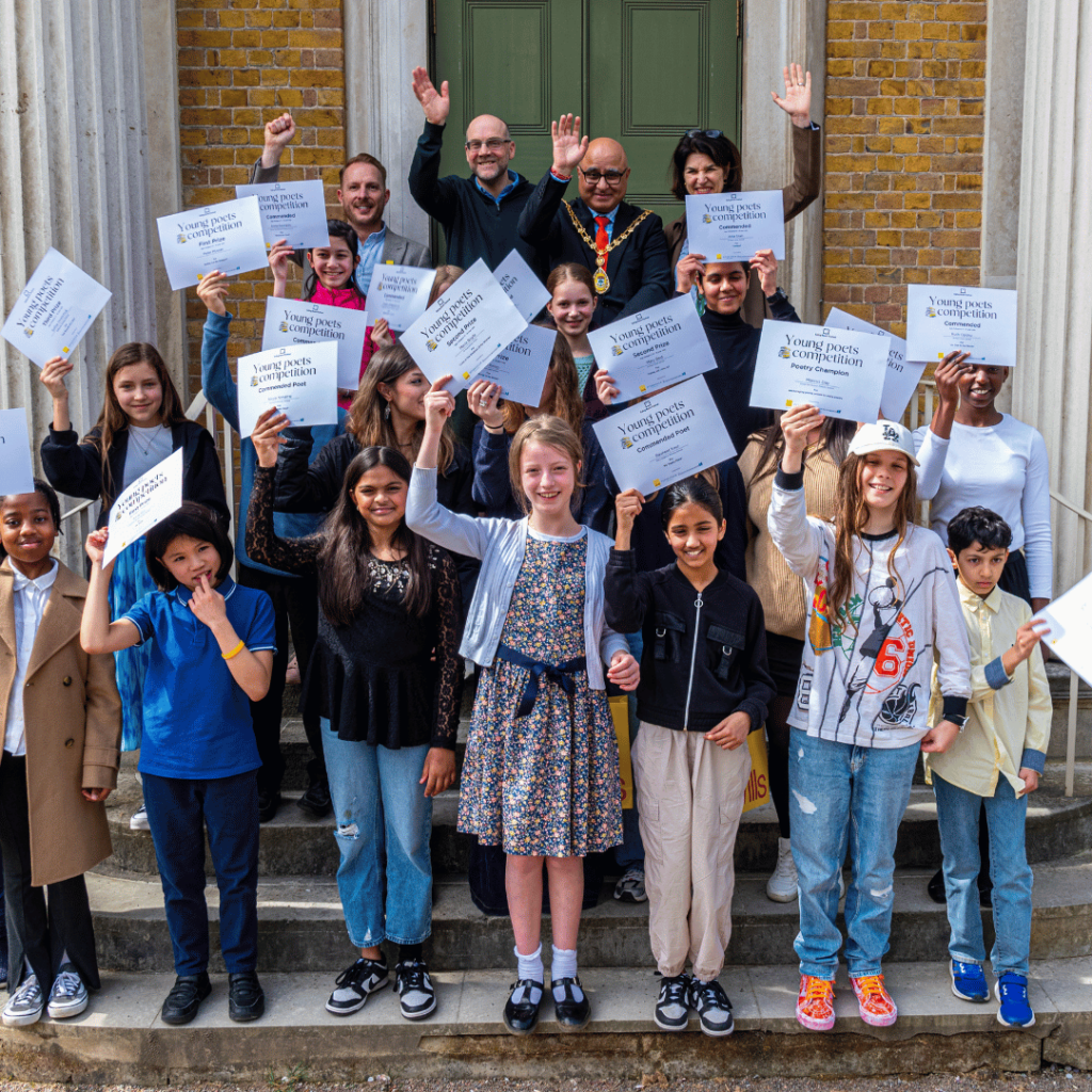 Group of young winners holding certificates on steps outside Pitzhanger Manor, celebrating a successful poetry competition.