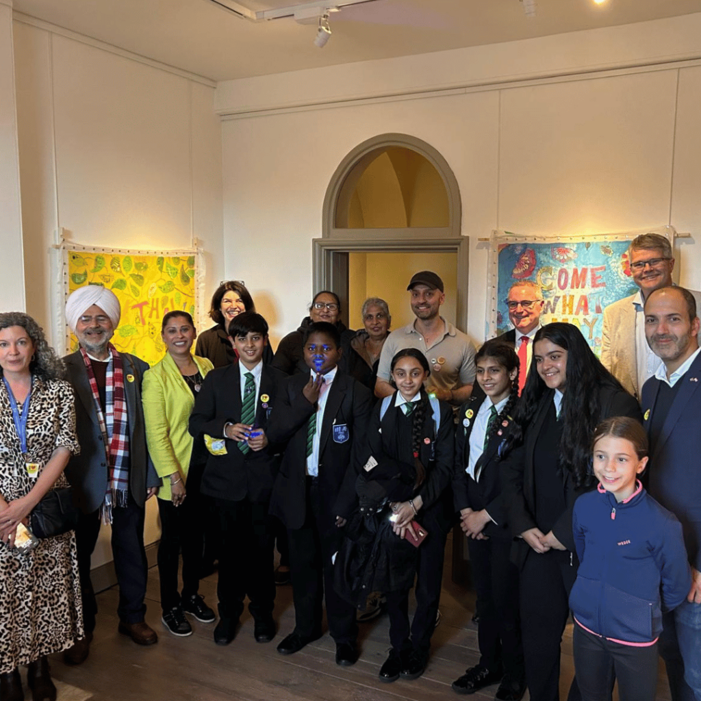 Local students and dignitaries unite to celebrate an inspiring art exhibition reflecting cultural diversity and creativity.